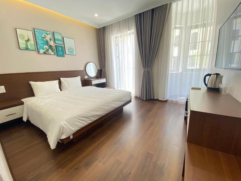 Postel nebo postele na pokoji v ubytování MOONLIGHT HOTEL