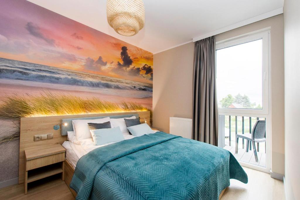 Кровать или кровати в номере Apartamenty Baltic Island