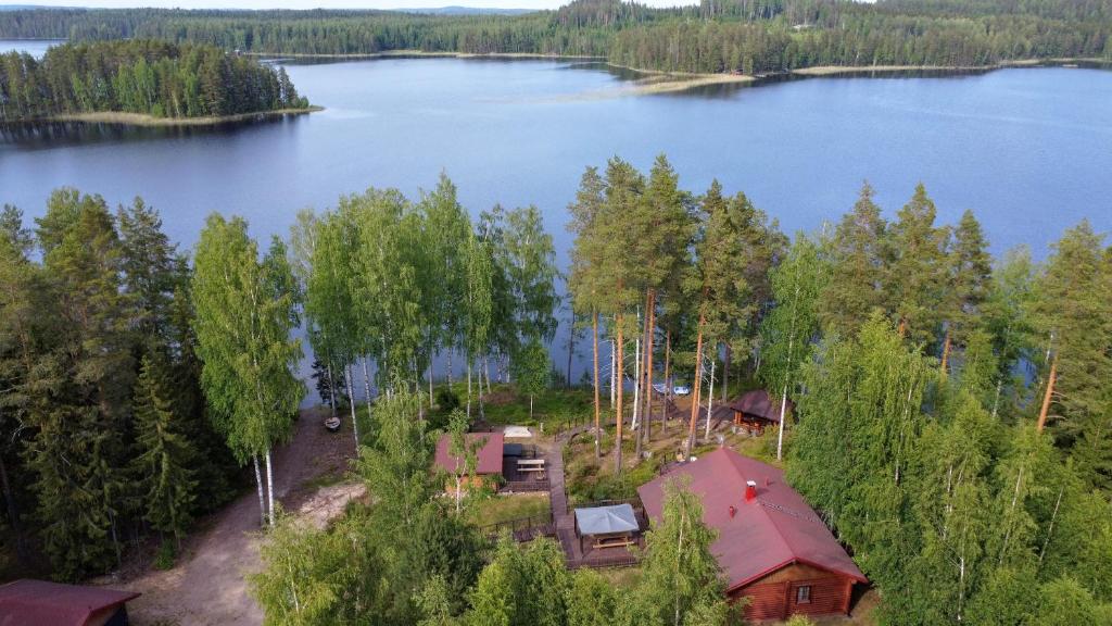 an aerial view of a cabin on a lake at Villa Joutsen with jacuzzi in Vuoriniemi