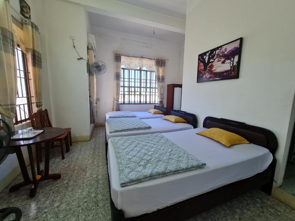 Postel nebo postele na pokoji v ubytování Nhà Nghỉ Bắc Nam