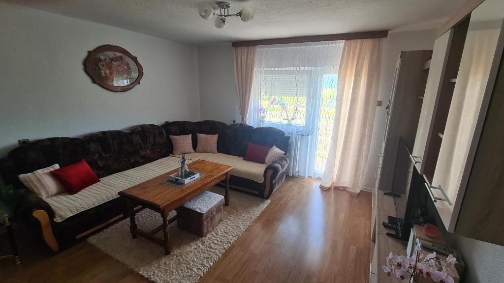 a living room with a couch and a table at Apartment Dolic in Livno