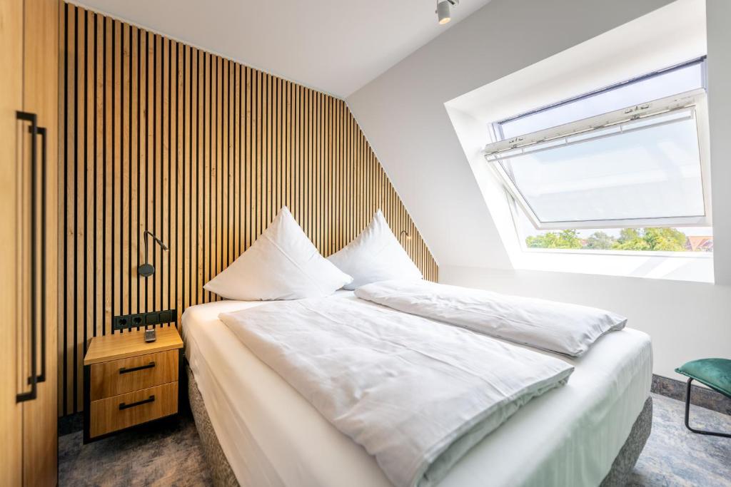 Postel nebo postele na pokoji v ubytování Hotel Südblick