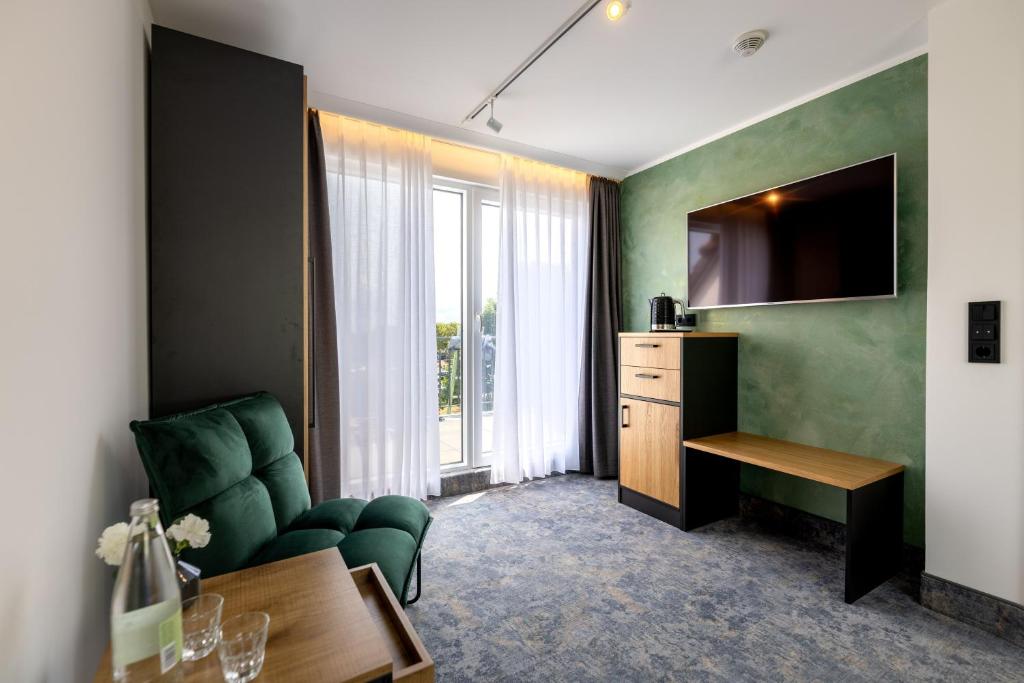 TV a/nebo společenská místnost v ubytování Hotel Südblick