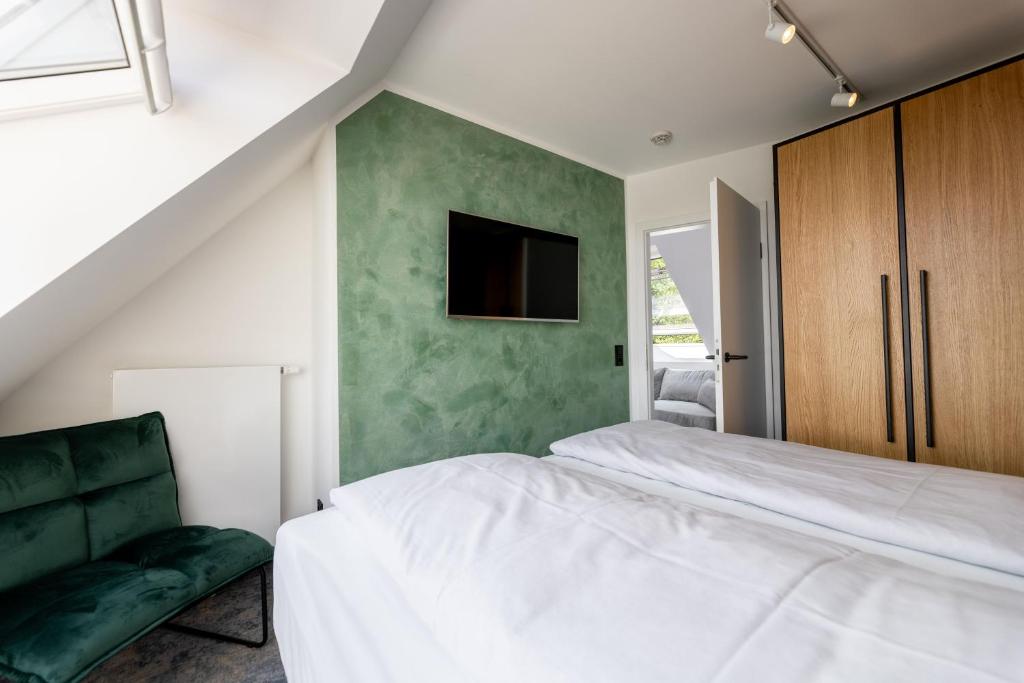 Postel nebo postele na pokoji v ubytování Hotel Südblick