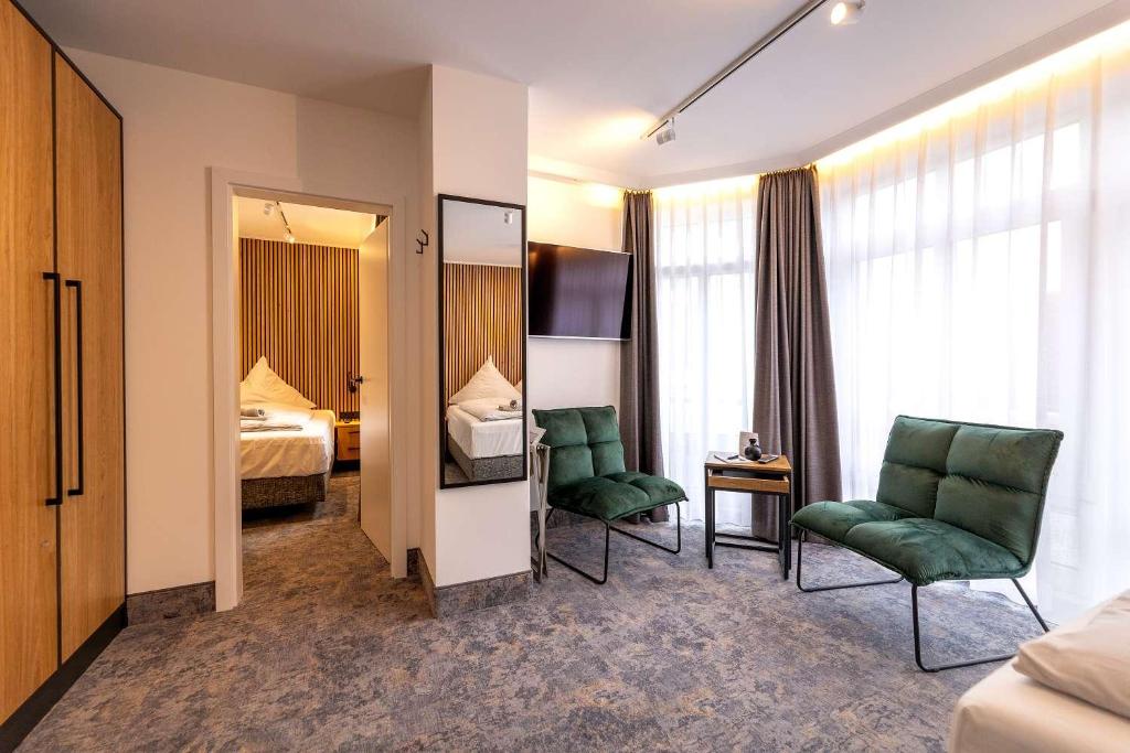 Postel nebo postele na pokoji v ubytování Hotel Südblick