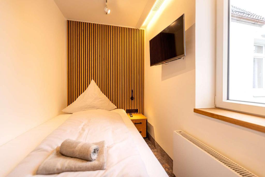 Postel nebo postele na pokoji v ubytování Hotel Südblick
