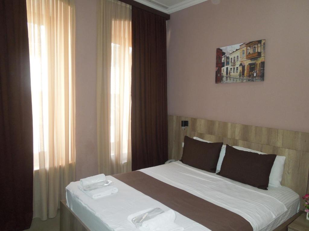 Postel nebo postele na pokoji v ubytování Epic Meidan Hotel