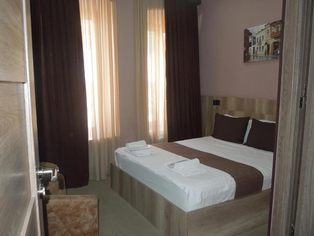 Postel nebo postele na pokoji v ubytování Epic Meidan Hotel