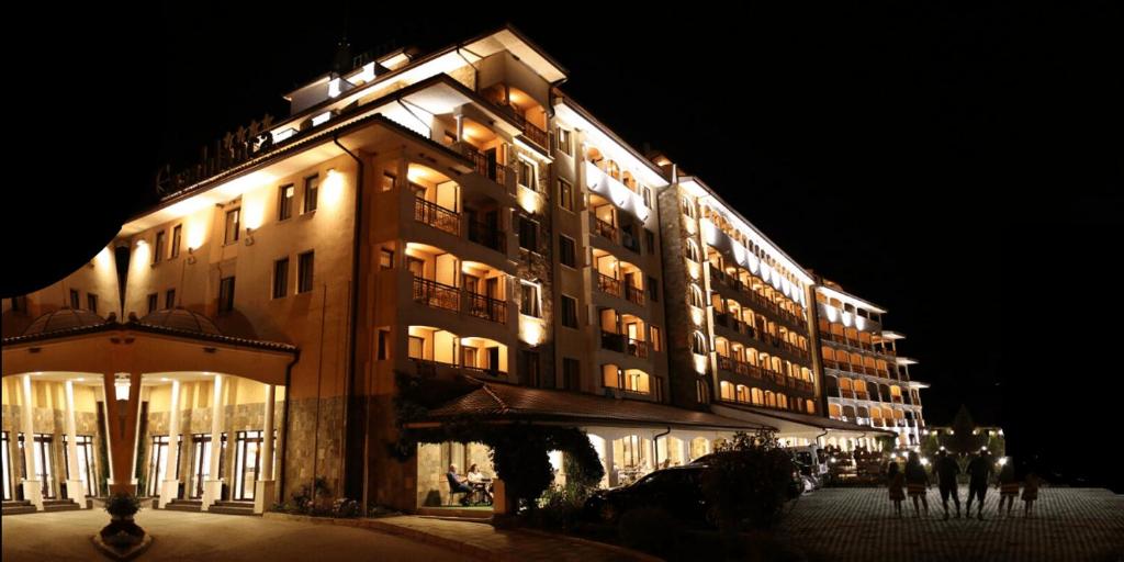 a large building with lights on it at night at Casablanca Hotel - All Inclusive in Obzor