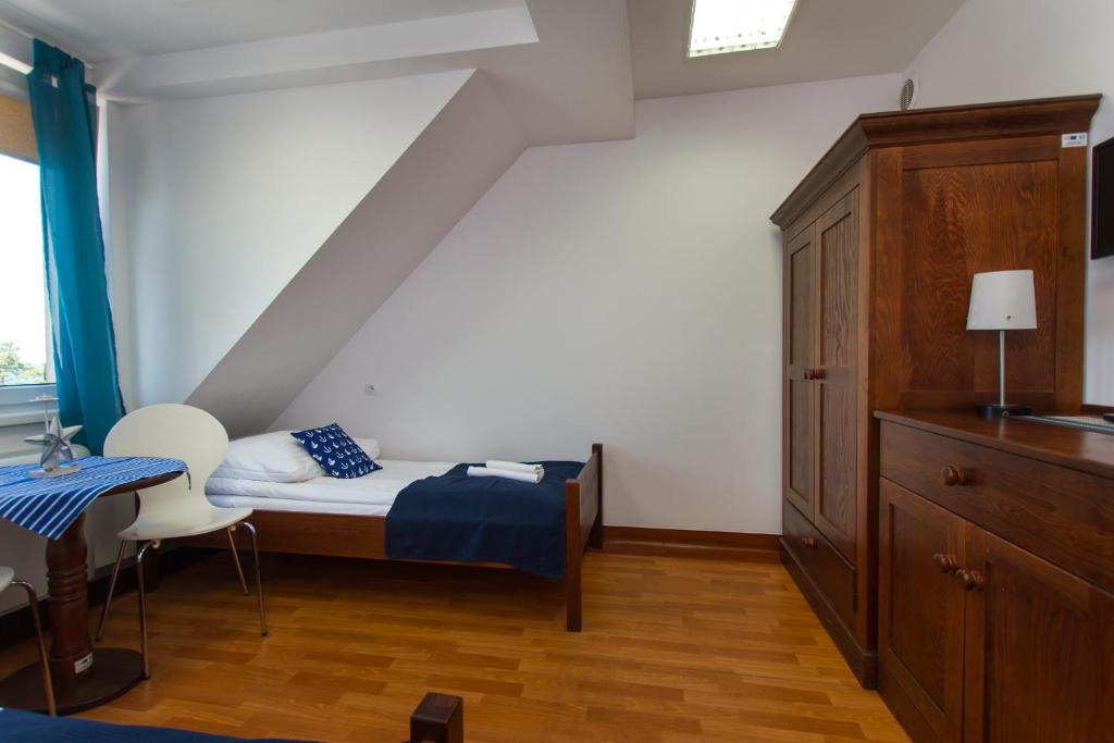Postel nebo postele na pokoji v ubytování DALBA pokoje przy samej plaży