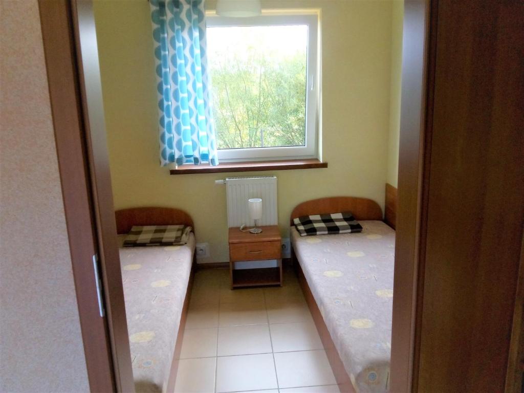 Postel nebo postele na pokoji v ubytování luna