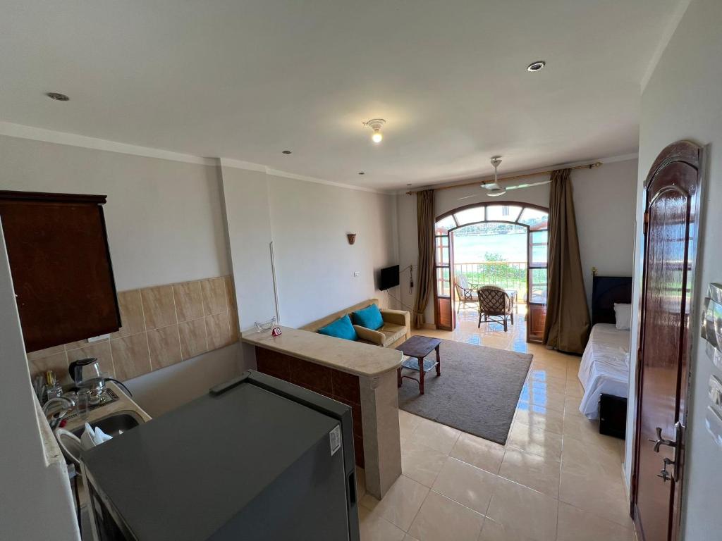 Ένα ή περισσότερα κρεβάτια σε δωμάτιο στο Luxor Plaza House