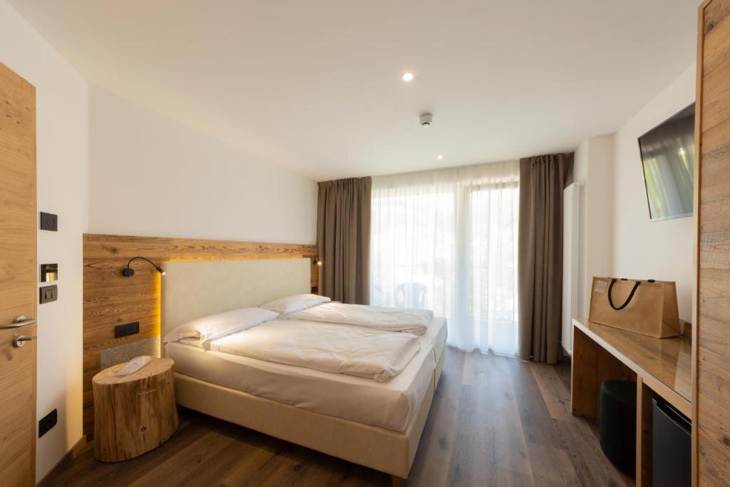 Postel nebo postele na pokoji v ubytování Active Alm Hotel