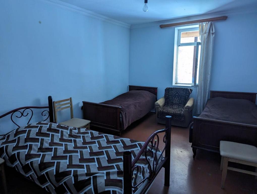 Postel nebo postele na pokoji v ubytování Doxturi's sakhli