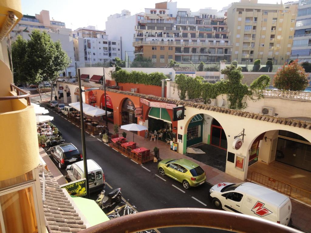 a view of a city street with cars and buildings at Jardin Calpe Apartment in Calpe