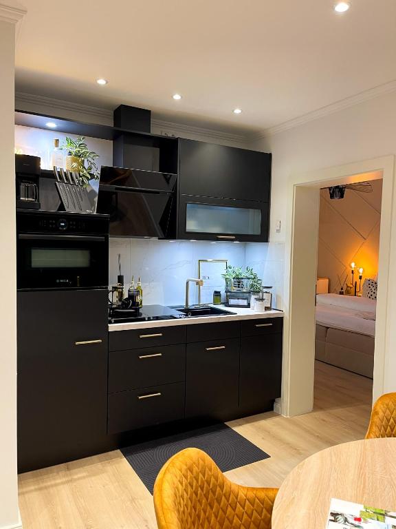 Kuchyň nebo kuchyňský kout v ubytování Ferienwohnung Domizil am Delft II Emden