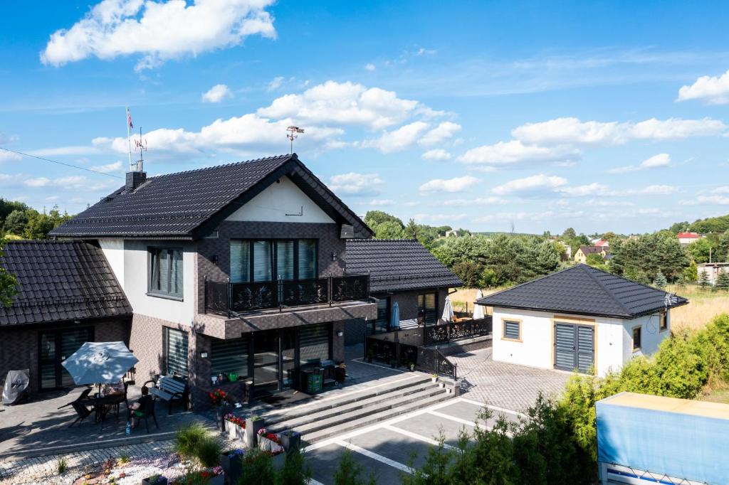 an aerial view of a house with a roof at Willa Pod Zamczyskiem in Podzamcze