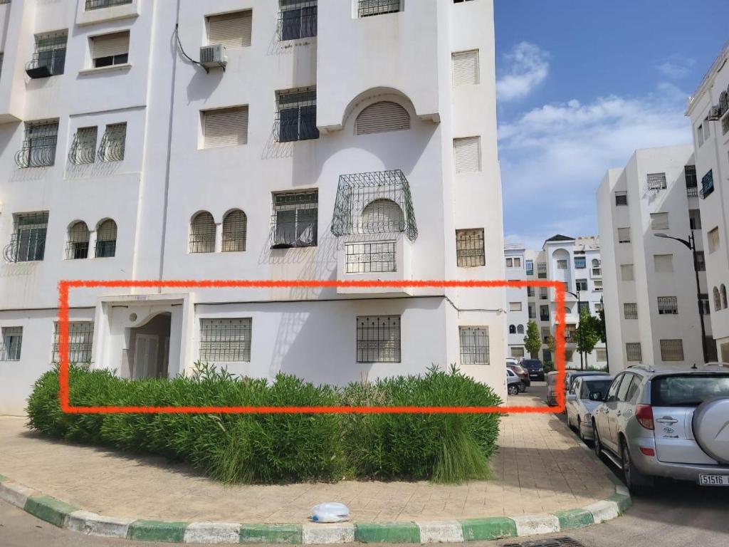 a building with an orange line on the side of it at complexe doha marjane tetouan in Tétouan