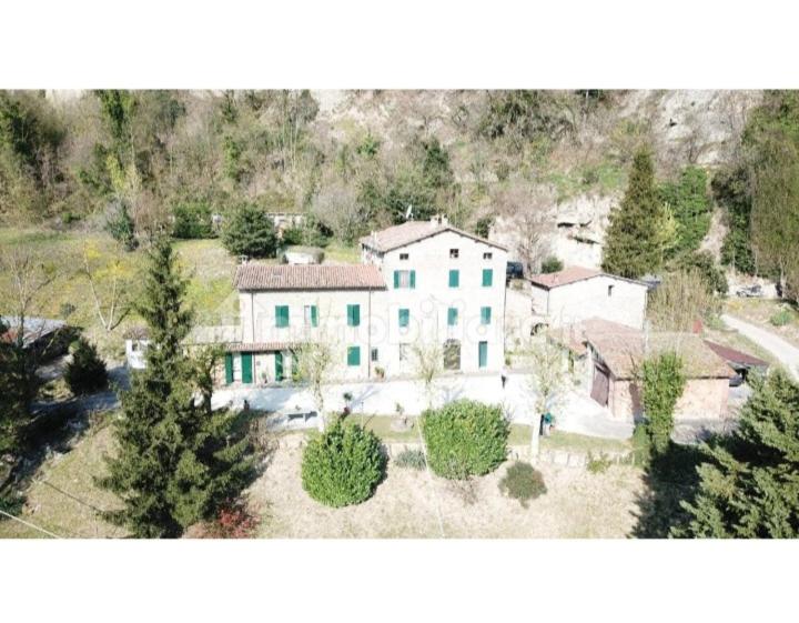 an aerial view of a large white house with trees at B&B BORGORI' in Rivola