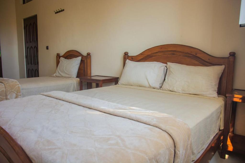 Postel nebo postele na pokoji v ubytování Hôtel Afoulki Tiznit