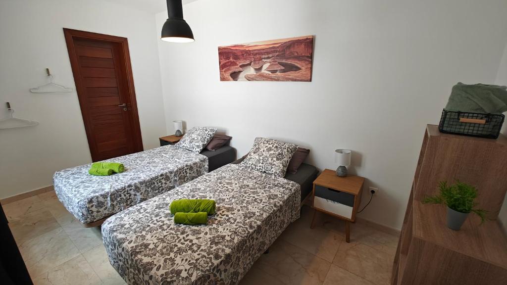 A bed or beds in a room at Casa del Sol Naciente - heated pools - wifi - UK,BE,NL,FR TV channels
