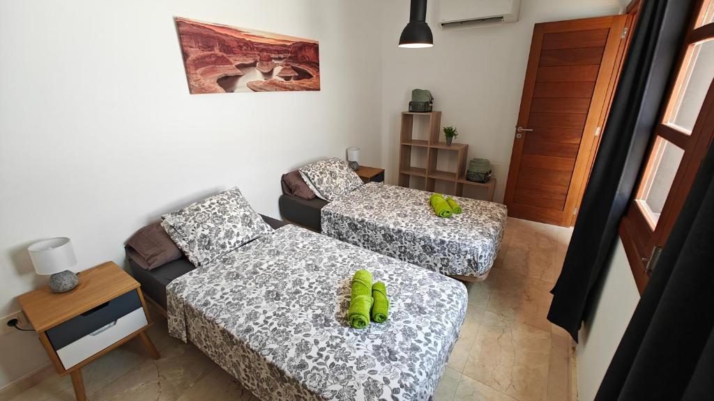 A bed or beds in a room at Casa del Sol Naciente - heated pools - wifi - UK,BE,NL,FR TV channels