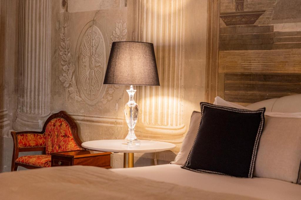Postel nebo postele na pokoji v ubytování Corte Realdi - Palazzo Camozzini