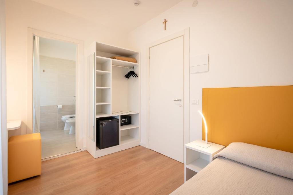 Posteľ alebo postele v izbe v ubytovaní Hotel Royal Garnì