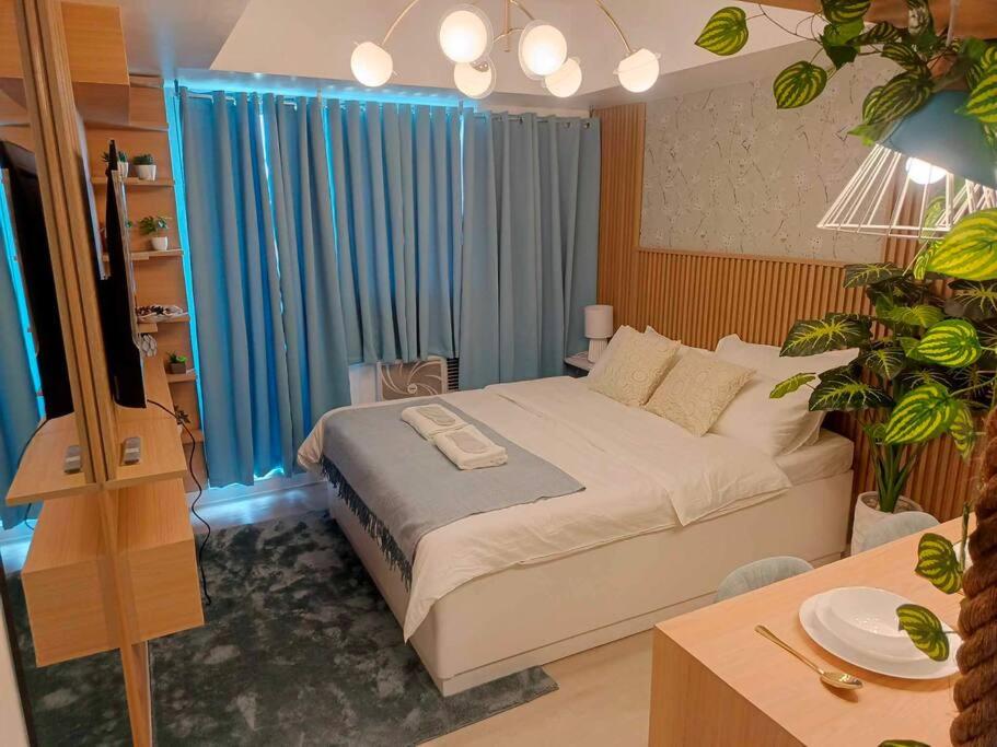 Postel nebo postele na pokoji v ubytování azuresky condotel