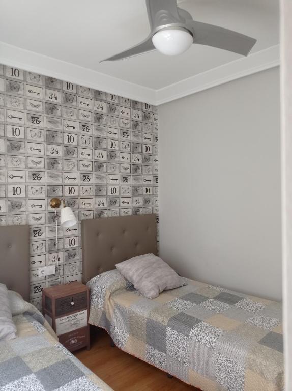 Postel nebo postele na pokoji v ubytování Serendipia Apartamentos 1