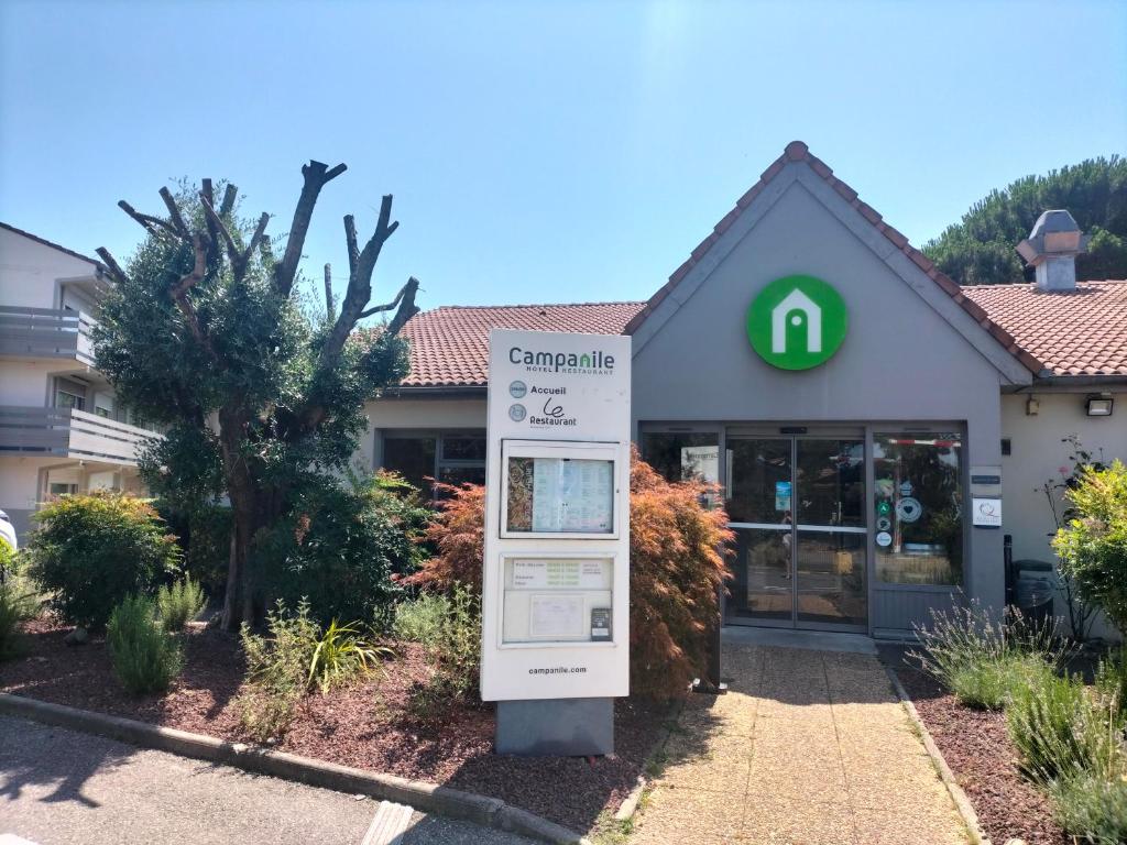 a sign in front of a gas station at Campanile Toulouse Nord l'Union in LʼUnion