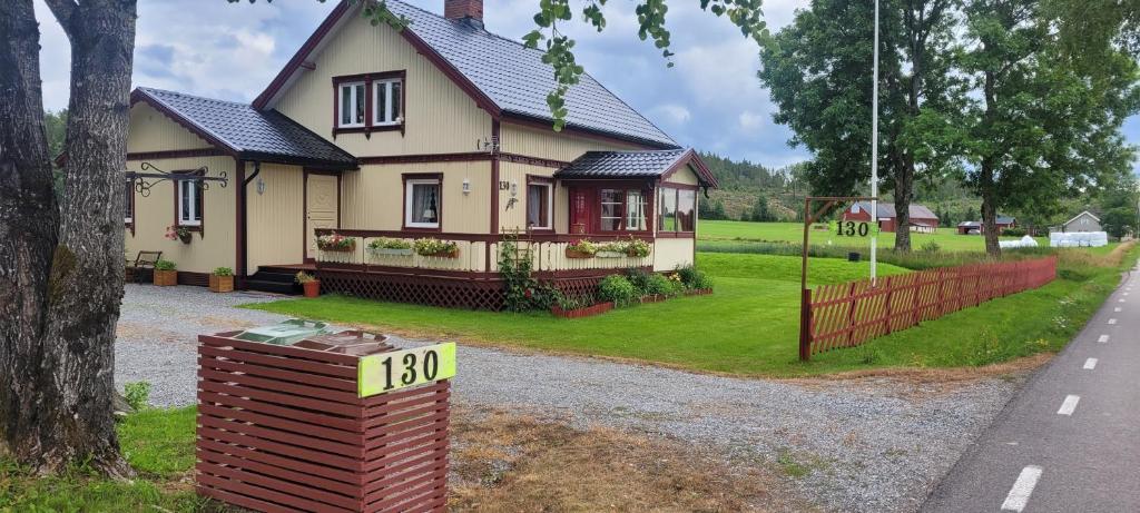 a house with a sign in front of it at Home Bjornbyn 130 in Ed