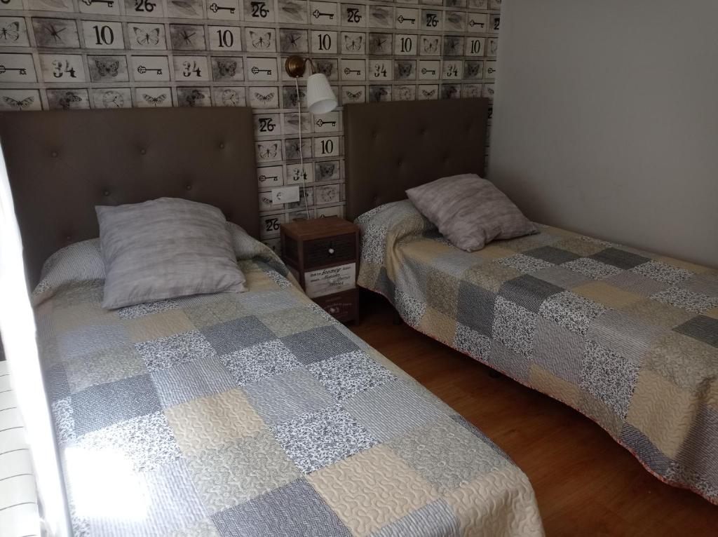 Postel nebo postele na pokoji v ubytování Serendipia Apartamentos 1