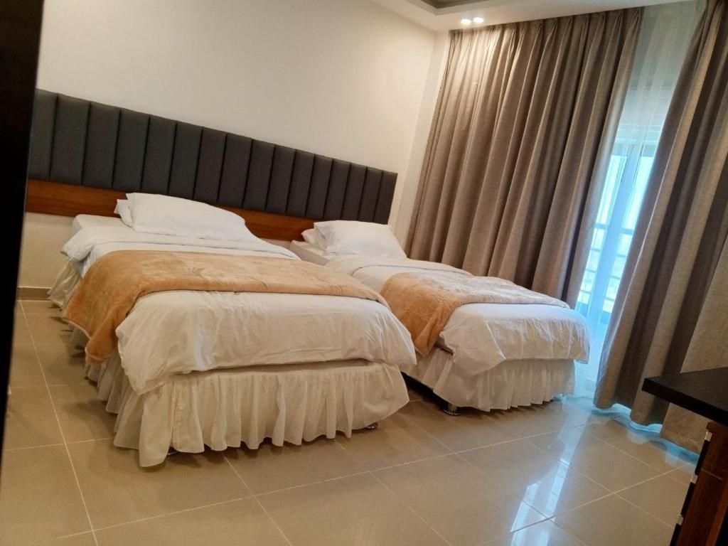 Postel nebo postele na pokoji v ubytování Sedrah Hotel