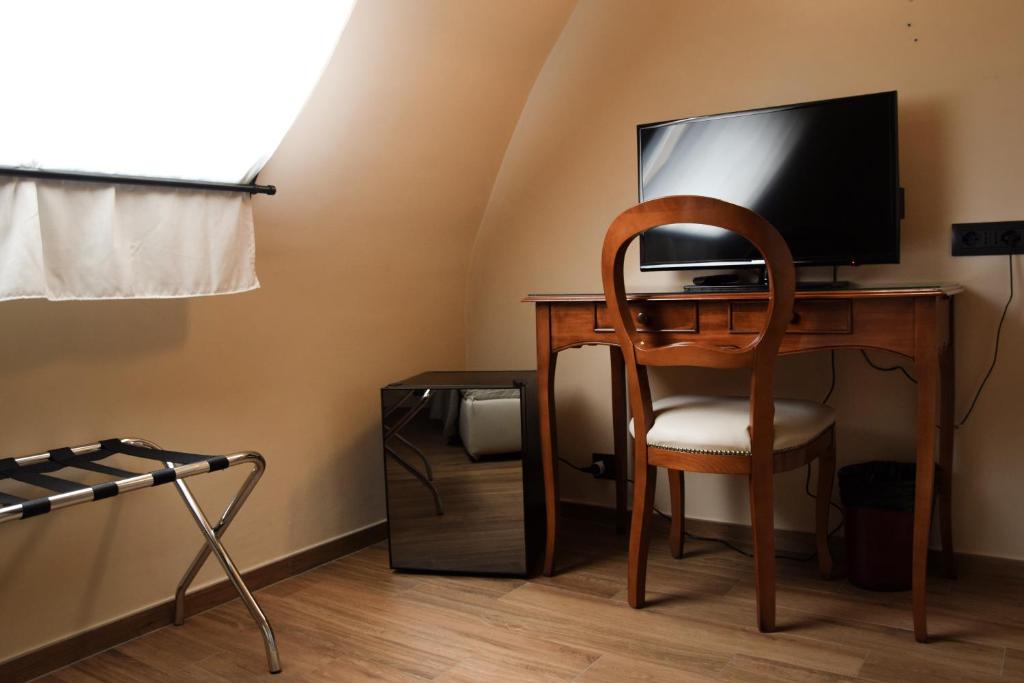 TV a/nebo společenská místnost v ubytování Hotel Valentino Du Parc
