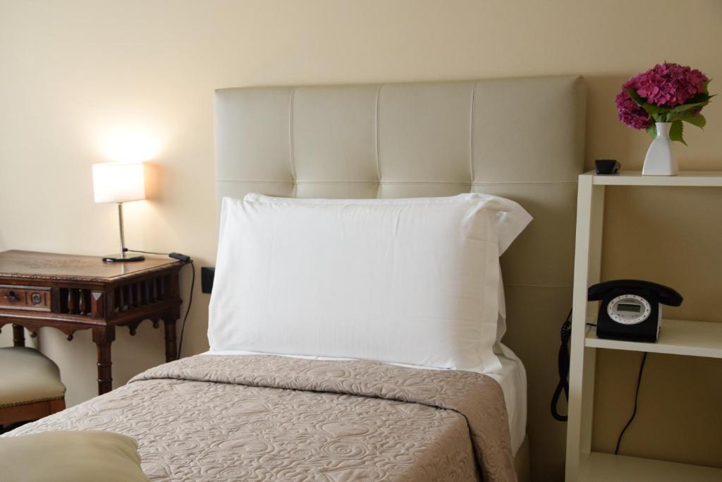 Postel nebo postele na pokoji v ubytování Hotel Valentino Du Parc