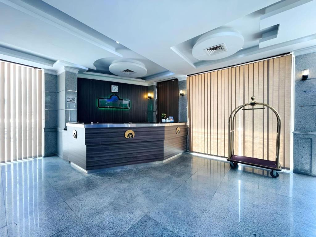 a lobby with a gate in the middle of a room at Relax Inn Furnished Apartments Hawally in Kuwait