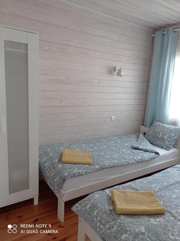 Postel nebo postele na pokoji v ubytování Strefa Kampinos