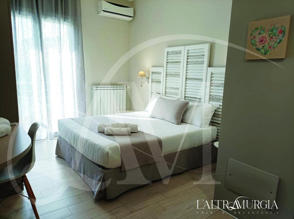 Postel nebo postele na pokoji v ubytování B&B L’ALTRAMURGIA