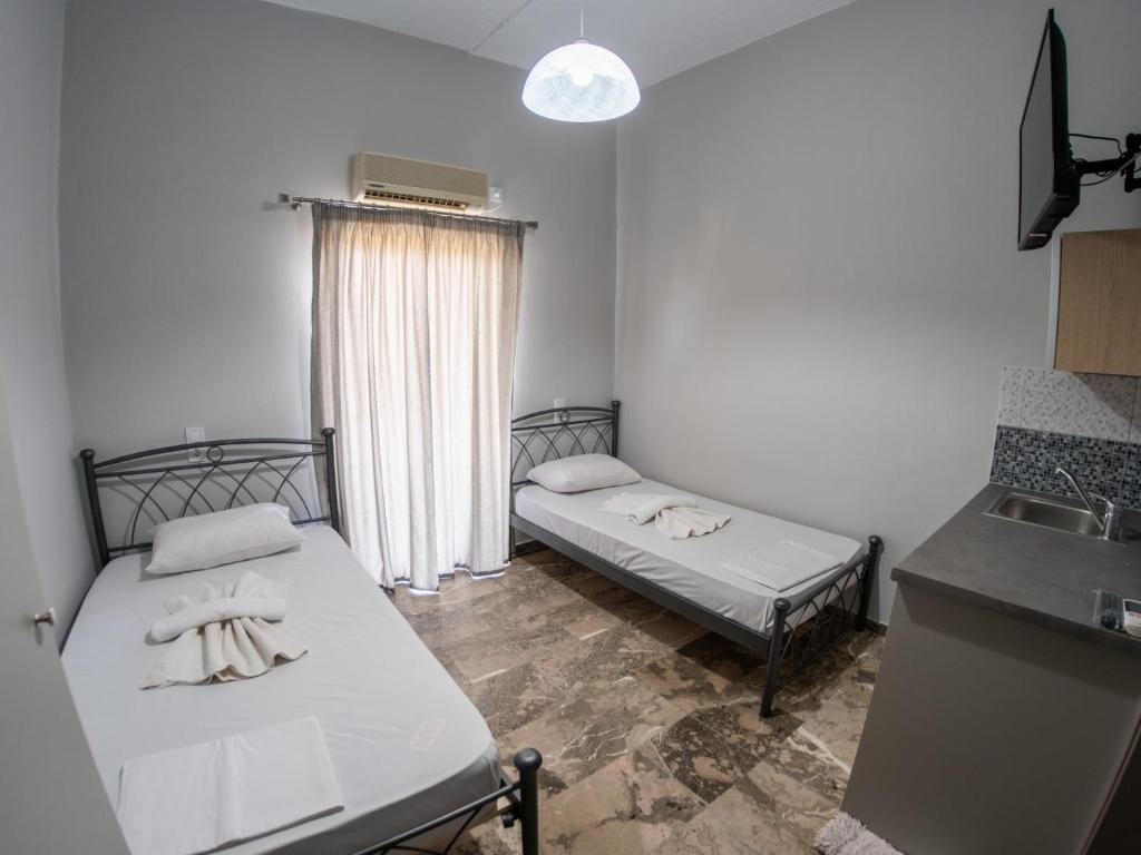 Postel nebo postele na pokoji v ubytování Pavlopetri