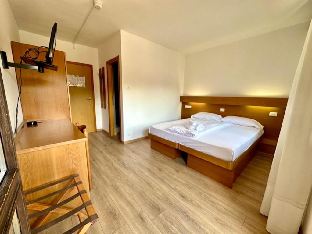 Postel nebo postele na pokoji v ubytování Hotel Ferrari