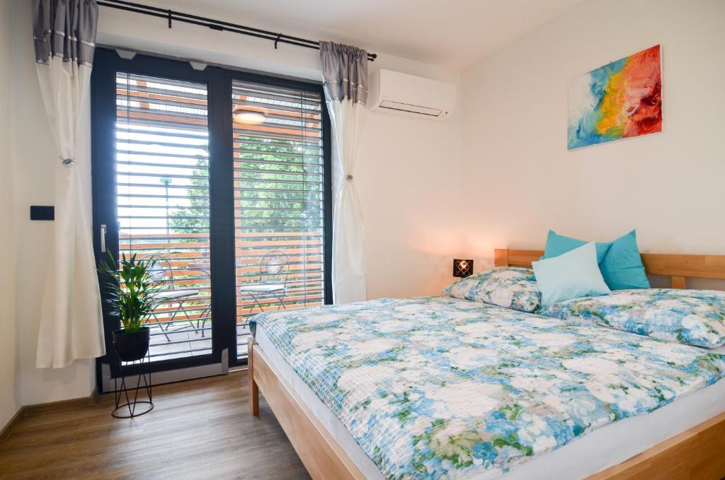 Postel nebo postele na pokoji v ubytování Apartmány Hrušky - wellness