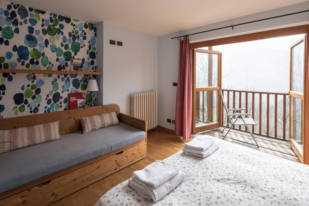 Postel nebo postele na pokoji v ubytování Rifugio Galaberna