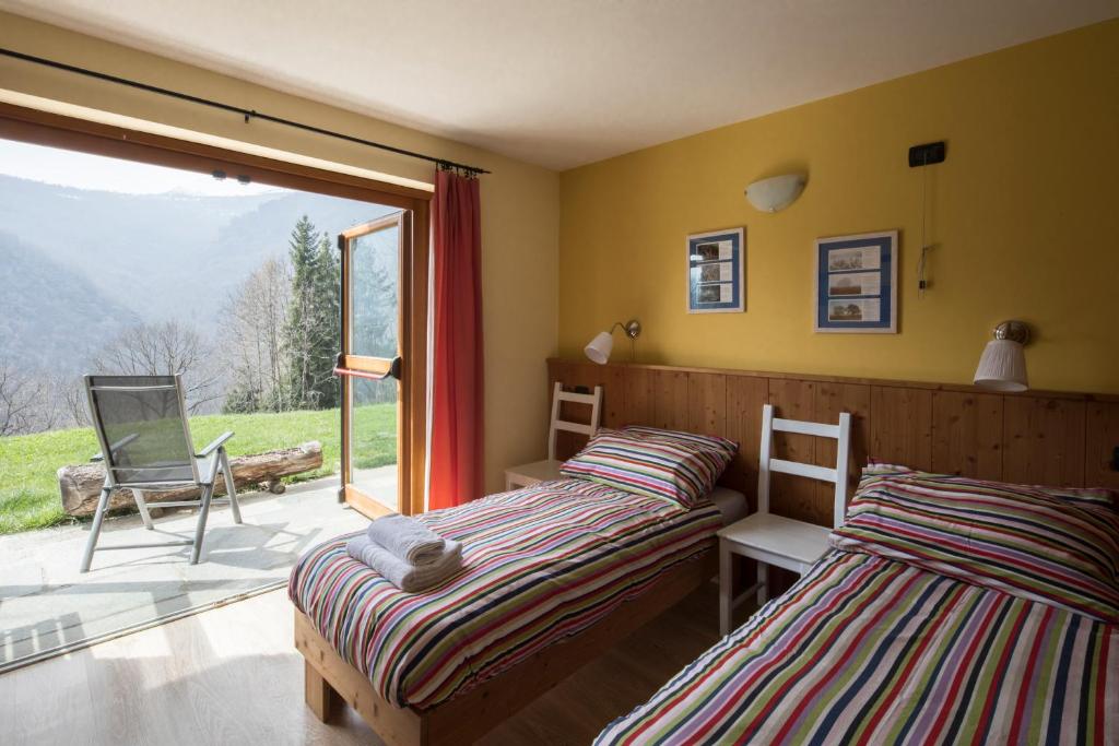Postel nebo postele na pokoji v ubytování Rifugio Galaberna