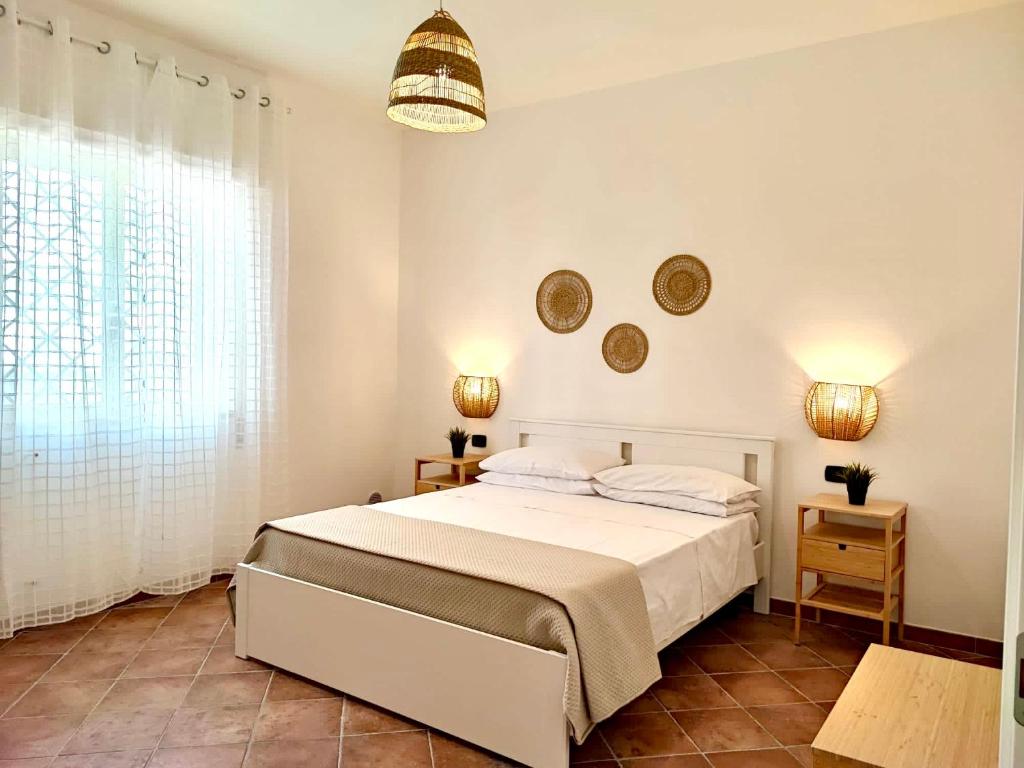 Кровать или кровати в номере Villa singola Amanda - 500m dal mare