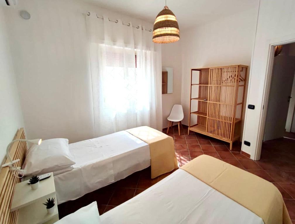 Кровать или кровати в номере Villa singola Amanda - 500m dal mare