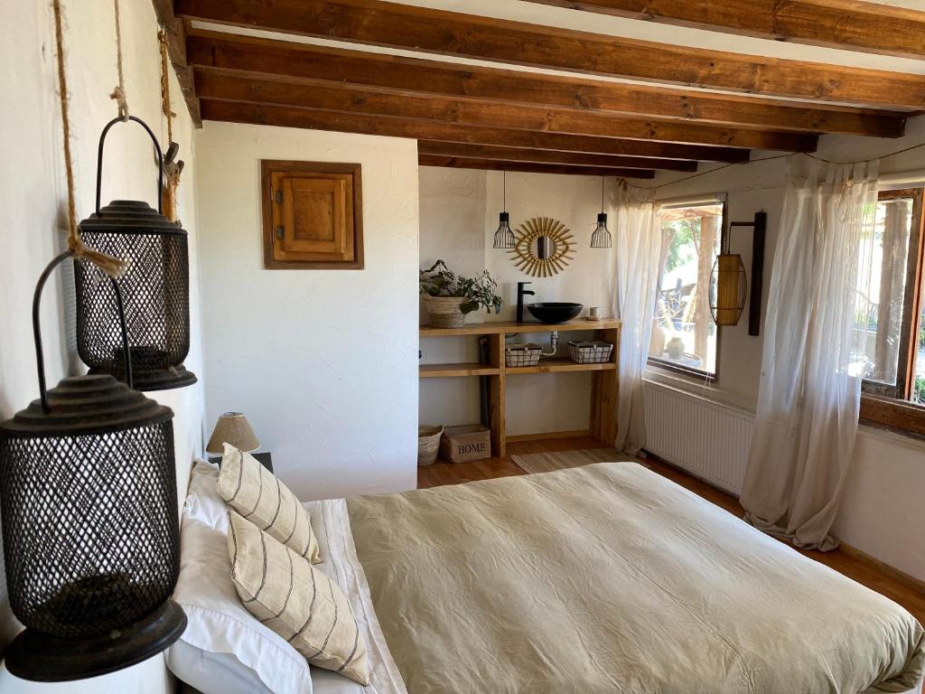 Postel nebo postele na pokoji v ubytování Posada Portal del Sol