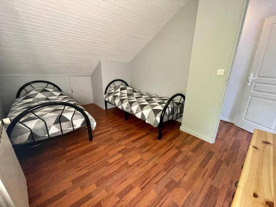 Postel nebo postele na pokoji v ubytování Maison
