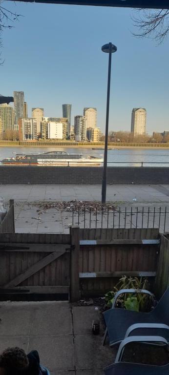 a view of a city with a street light and chairs at Seaview in London