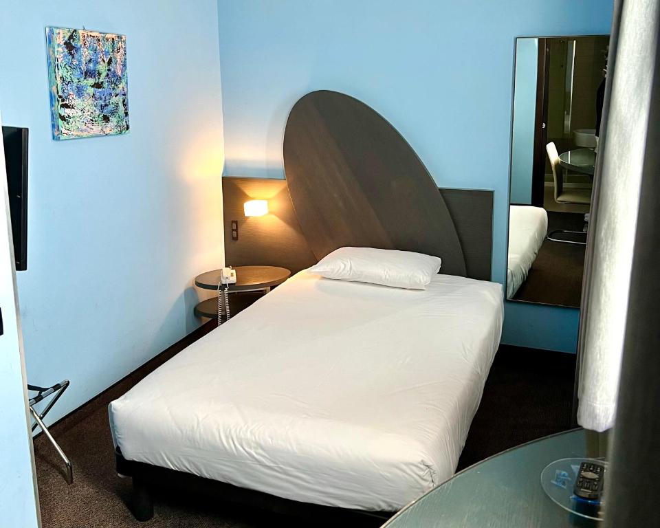 Postel nebo postele na pokoji v ubytování Hotel Ambra